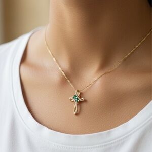 Elegant Gold Cross Necklace with Green Gemstones